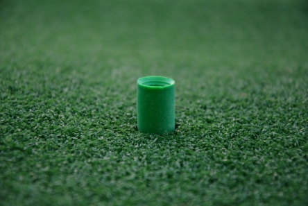 rubber tee in mat for iron shots